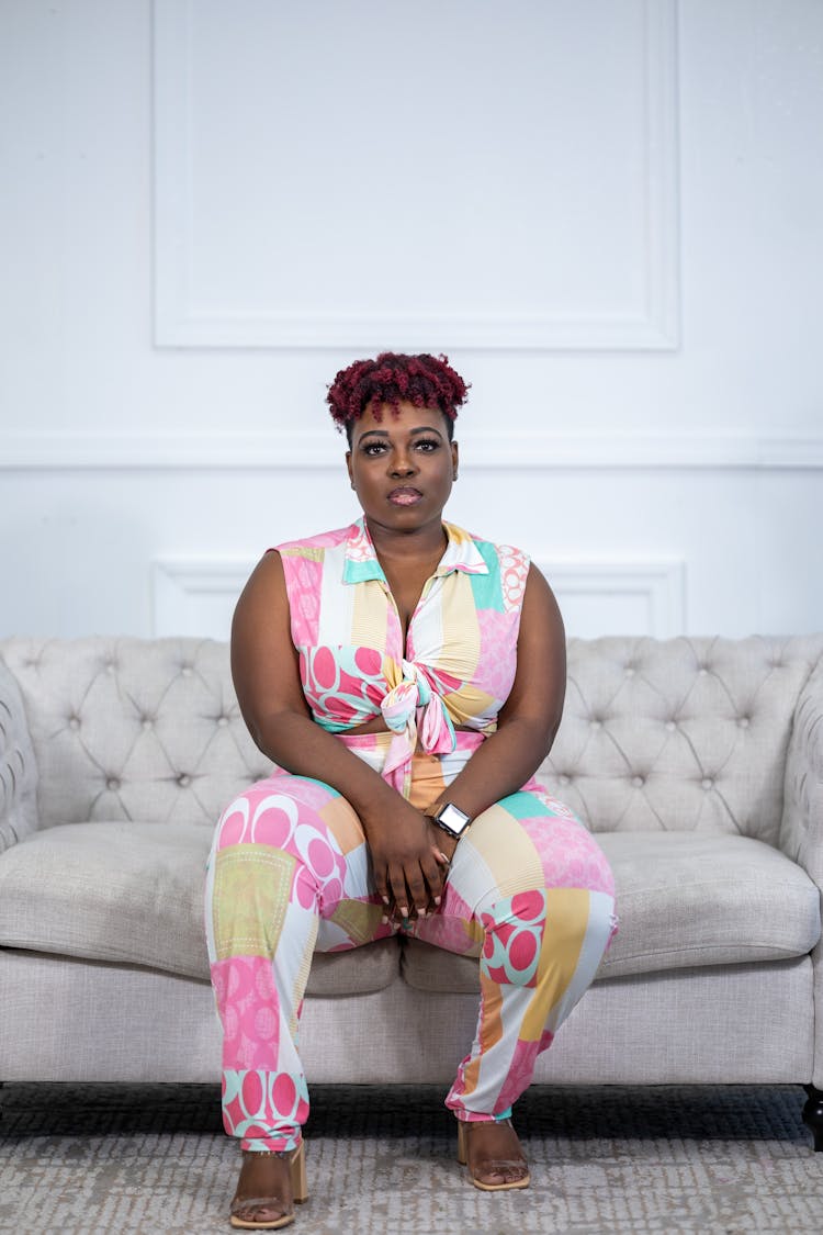 Stylish Overweight Woman Sitting On Couch