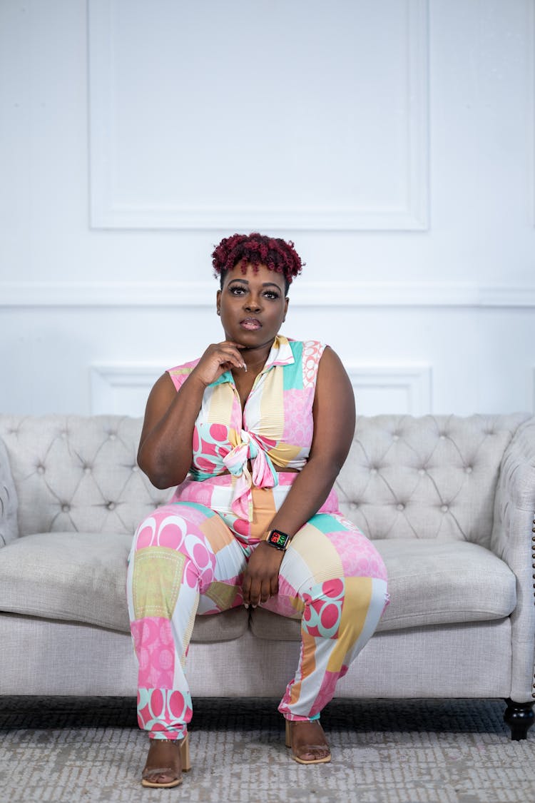 Stylish Overweight Woman Sitting On Couch