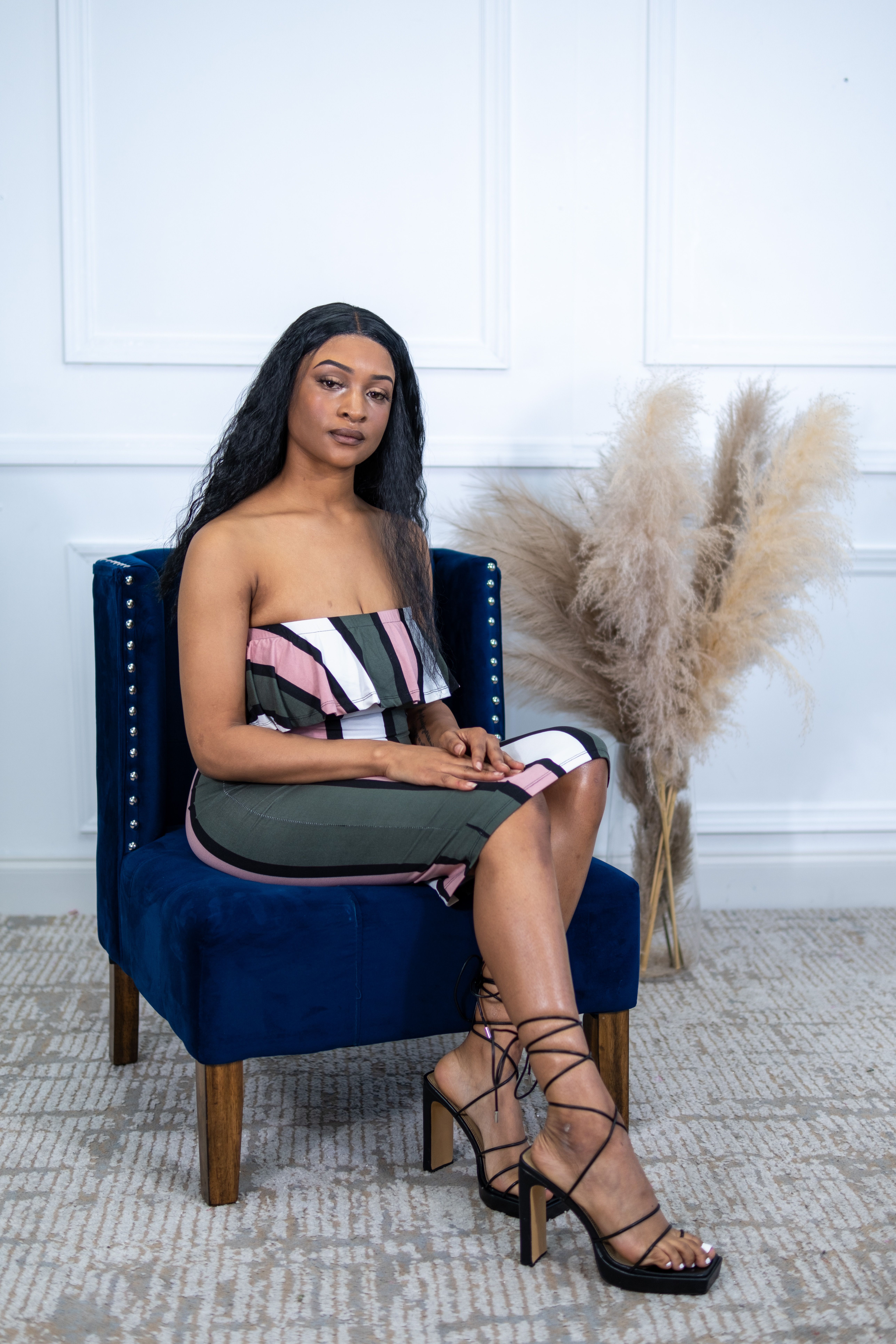 Young Woman in a Dress and High Heels Sitting in an Armchair · Free ...