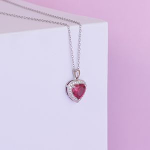 Garnet drop pendant on a silver chain — photo by Arif khan on Pexels