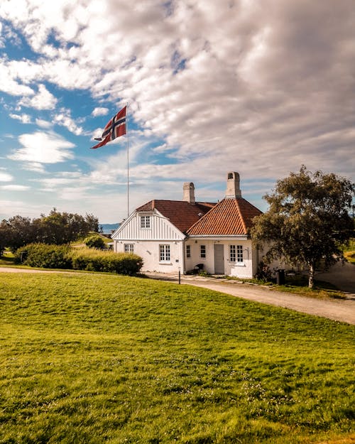 Free A House in a Rural Area with Flag of Norway Stock Photo