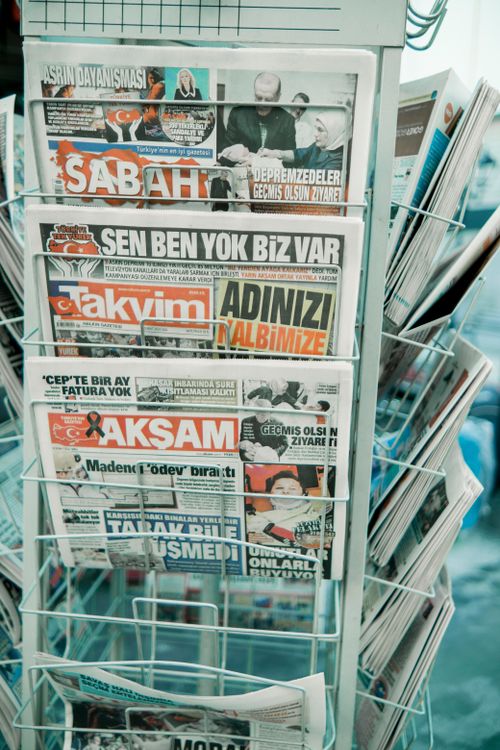Free Close-up of a rack with Turkish newspapers, showcasing headlines in vibrant colors. Stock Photo
