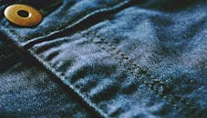 Blue Denim Textile With Brown Button