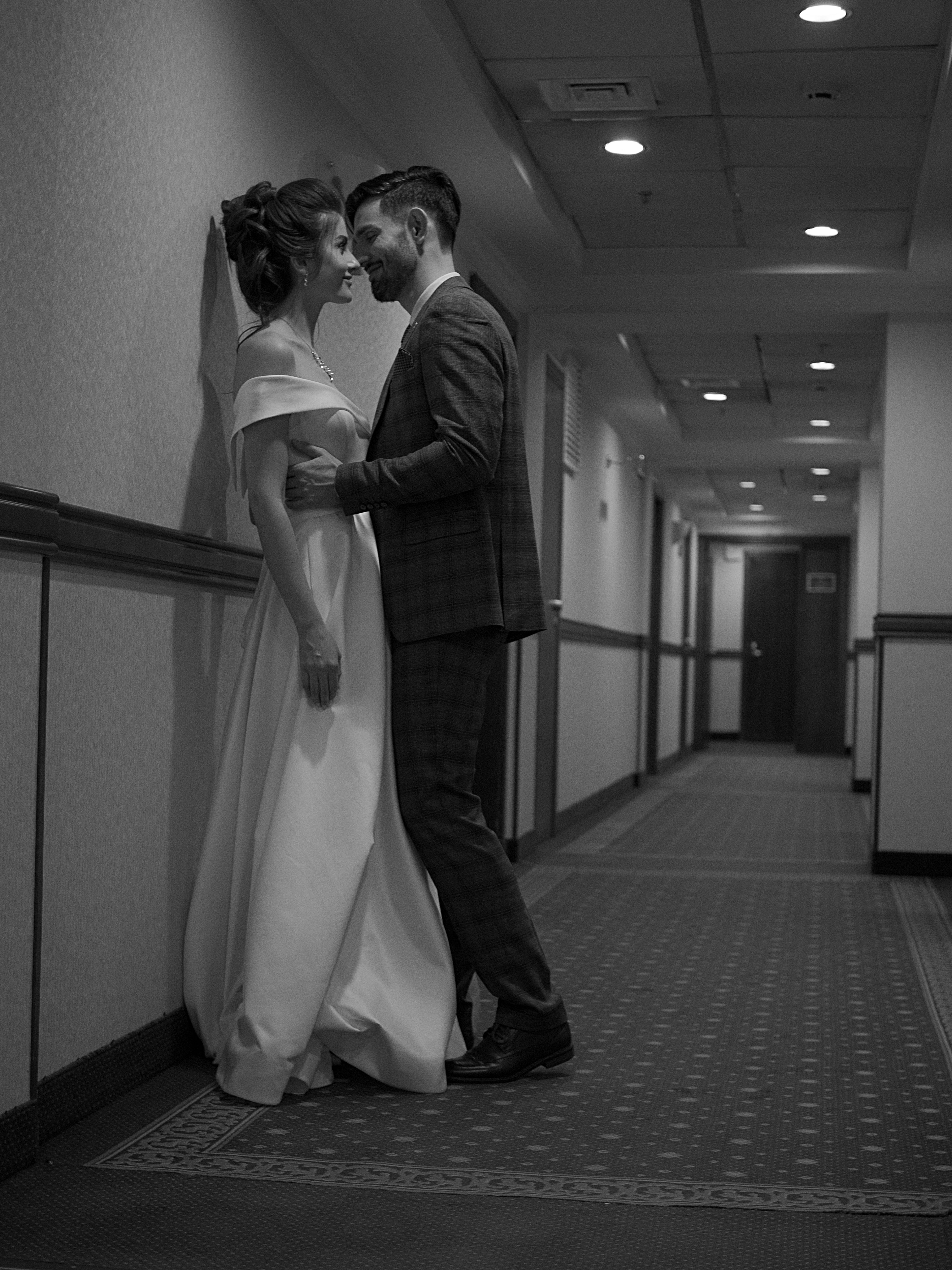 Newlyweds Standing Together in Corridor in Black and White · Free Stock ...