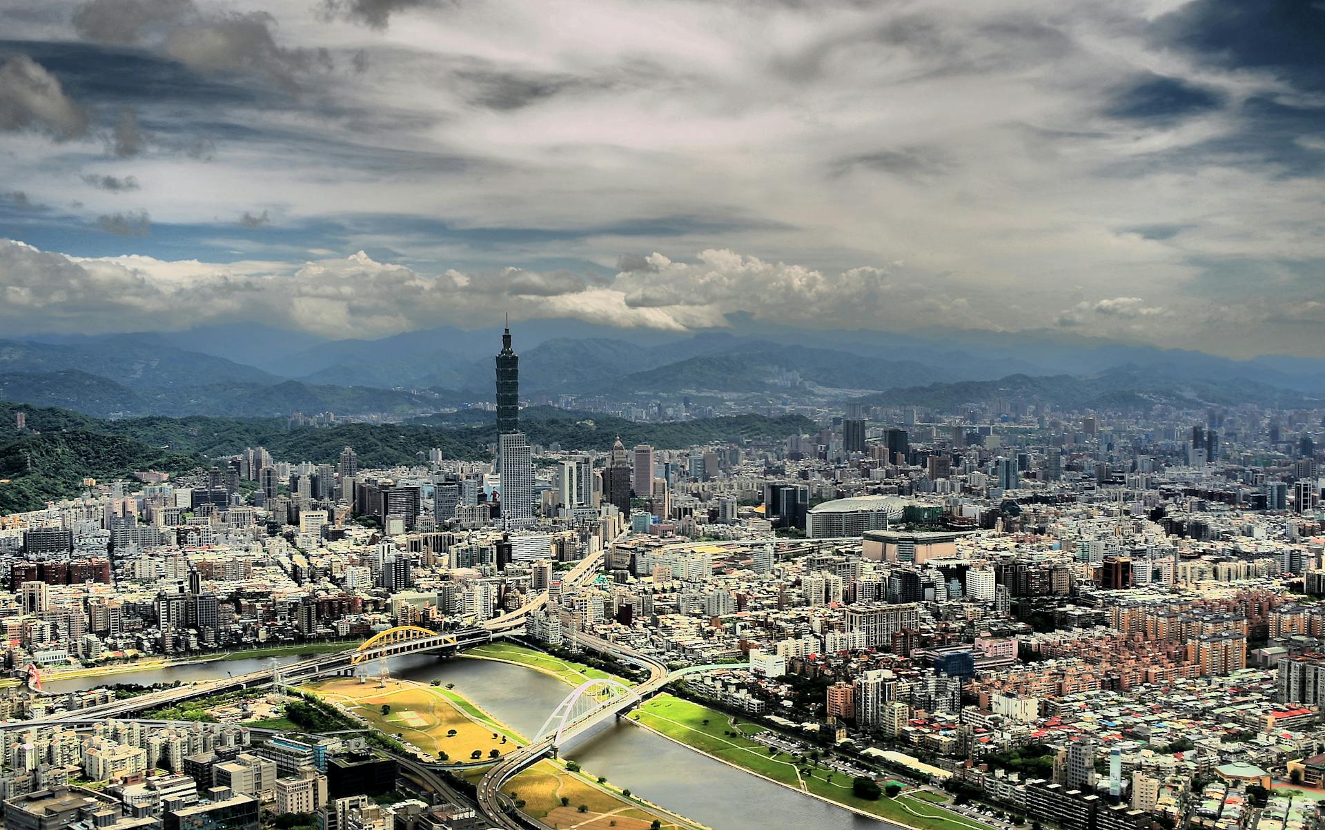 Stunning aerial photo of Taipei's skyline, featuring Taipei 101 and urban landscape.