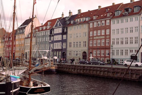 Waterfront Buildings and Boats on the Canal in the Nyhavn District in Copenhagen, Denmark 