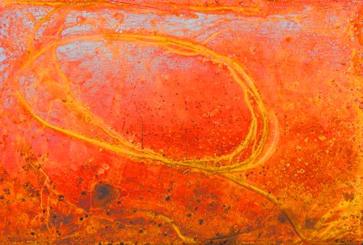 Bright and textured abstract art with vivid red and orange tones, featuring organic patterns.