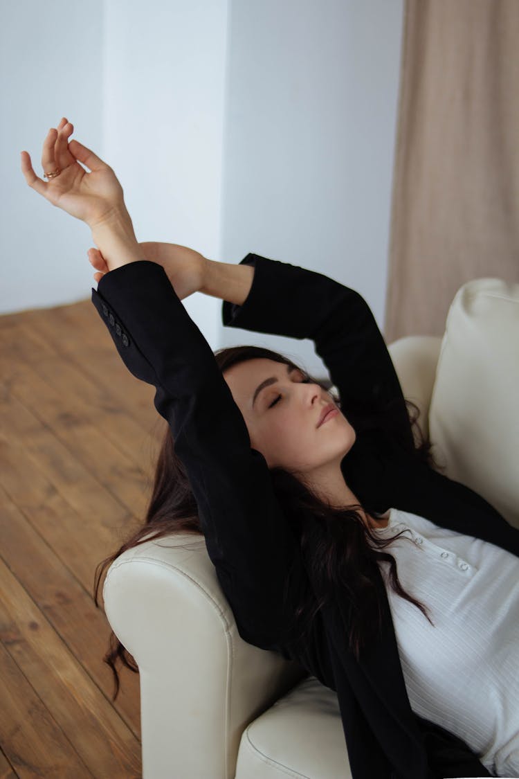 Woman Lying On Couch At Home