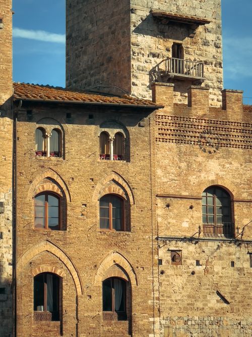 Free Explore the medieval architecture of San Gimignano with its iconic towers and rustic charm. Stock Photo