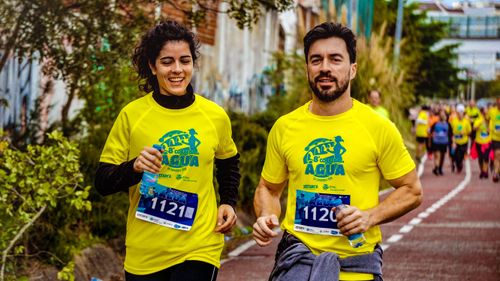 Free Two athletes participating in a marathon, showing determination and joy. Stock Photo