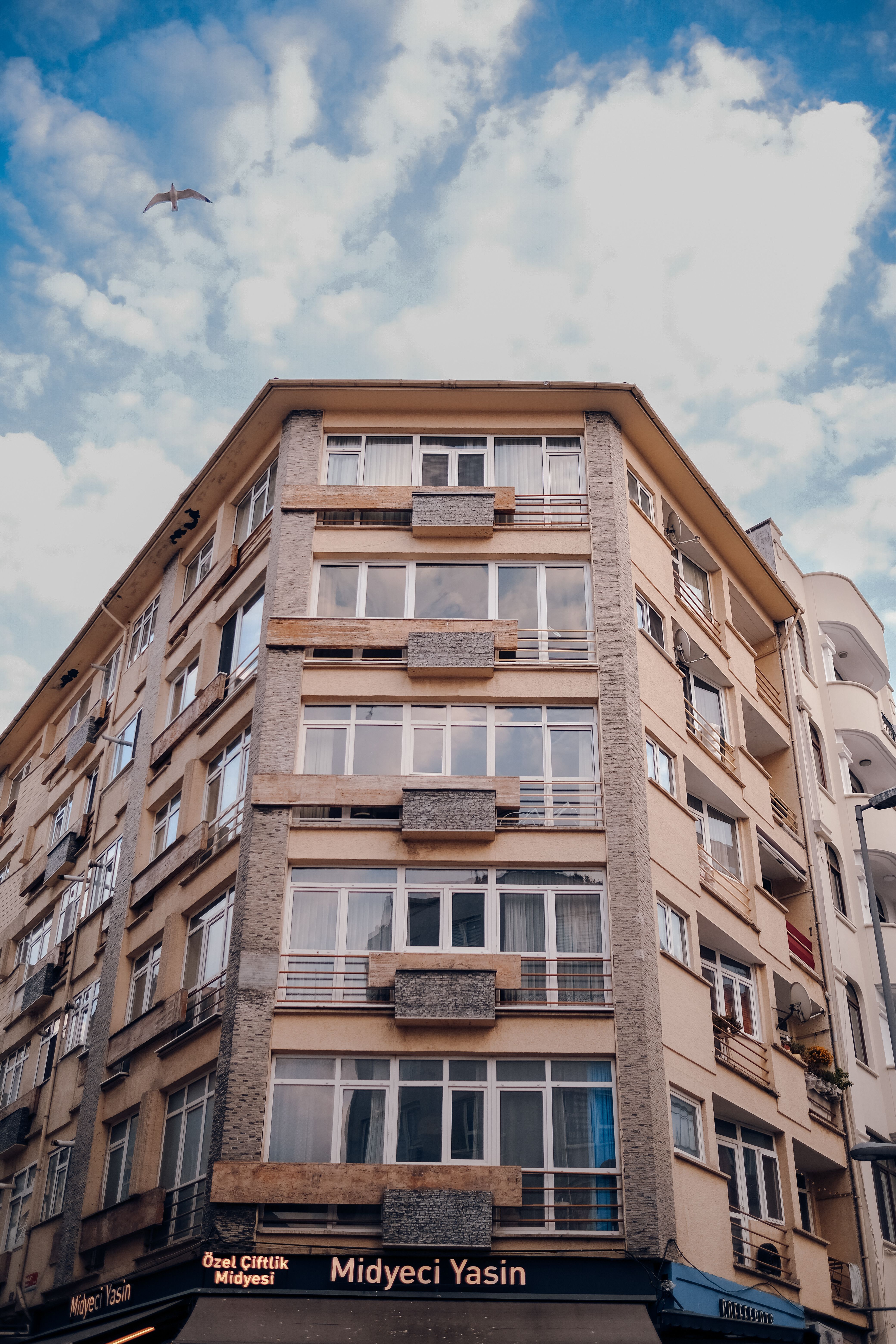 Residential Building against Blue Sky · Free Stock Photo