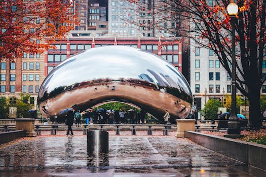 The iconic Cloud Gate sculpture, also known as The Bean, on a rainy day in Millennium Park, Chicago.