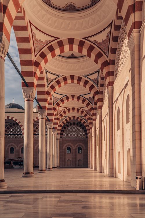 Free Majestic corridor of the Grand Çamlıca Mosque showcasing intricate arches and Islamic architecture. Stock Photo