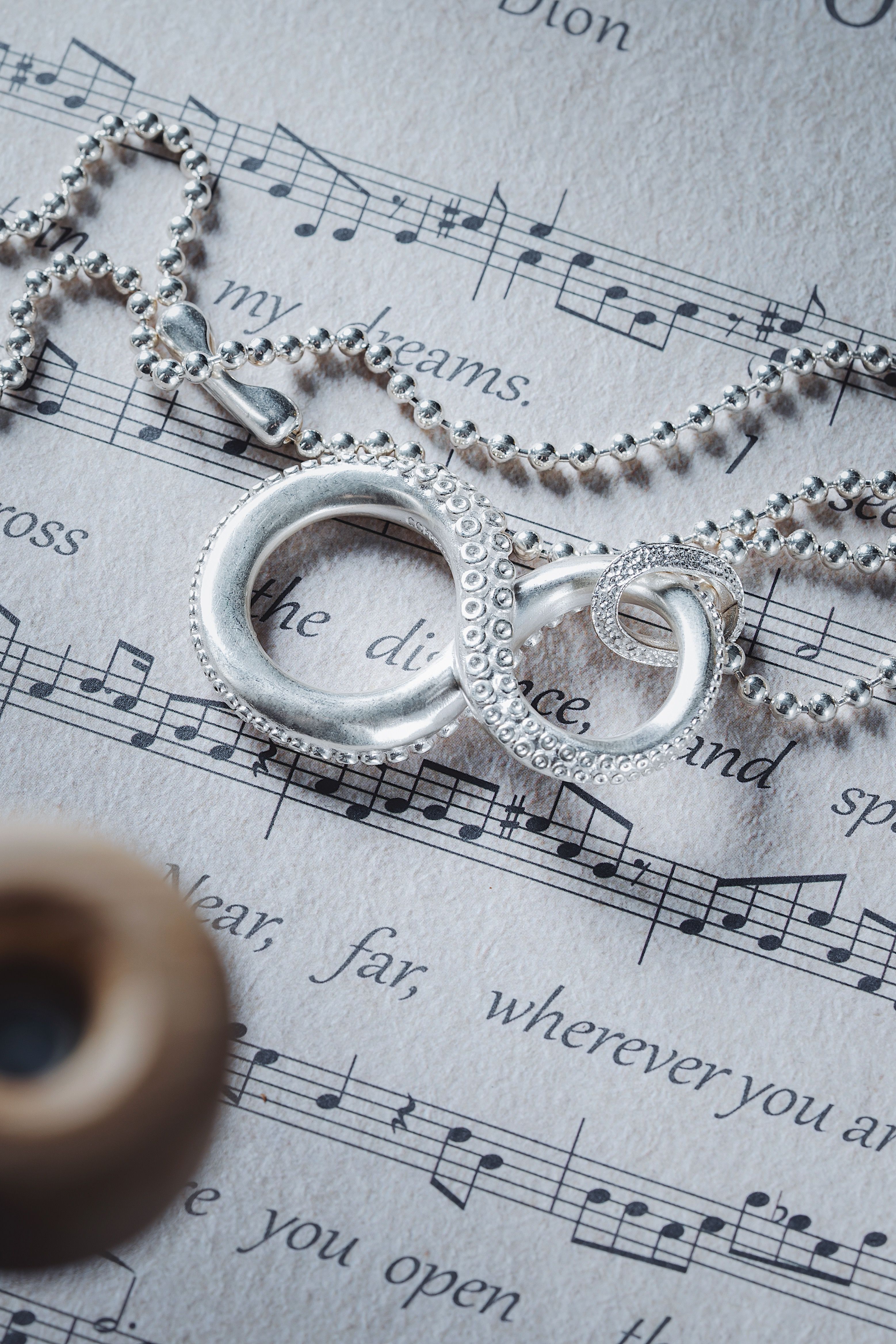 Octopus Infinity Symbol Necklace on Music Notes · Free Stock Photo