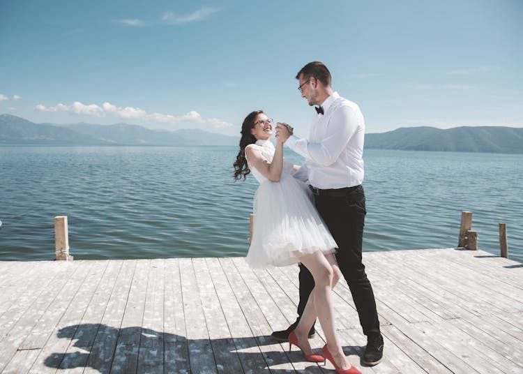 Man And Woman Dancing On Dock