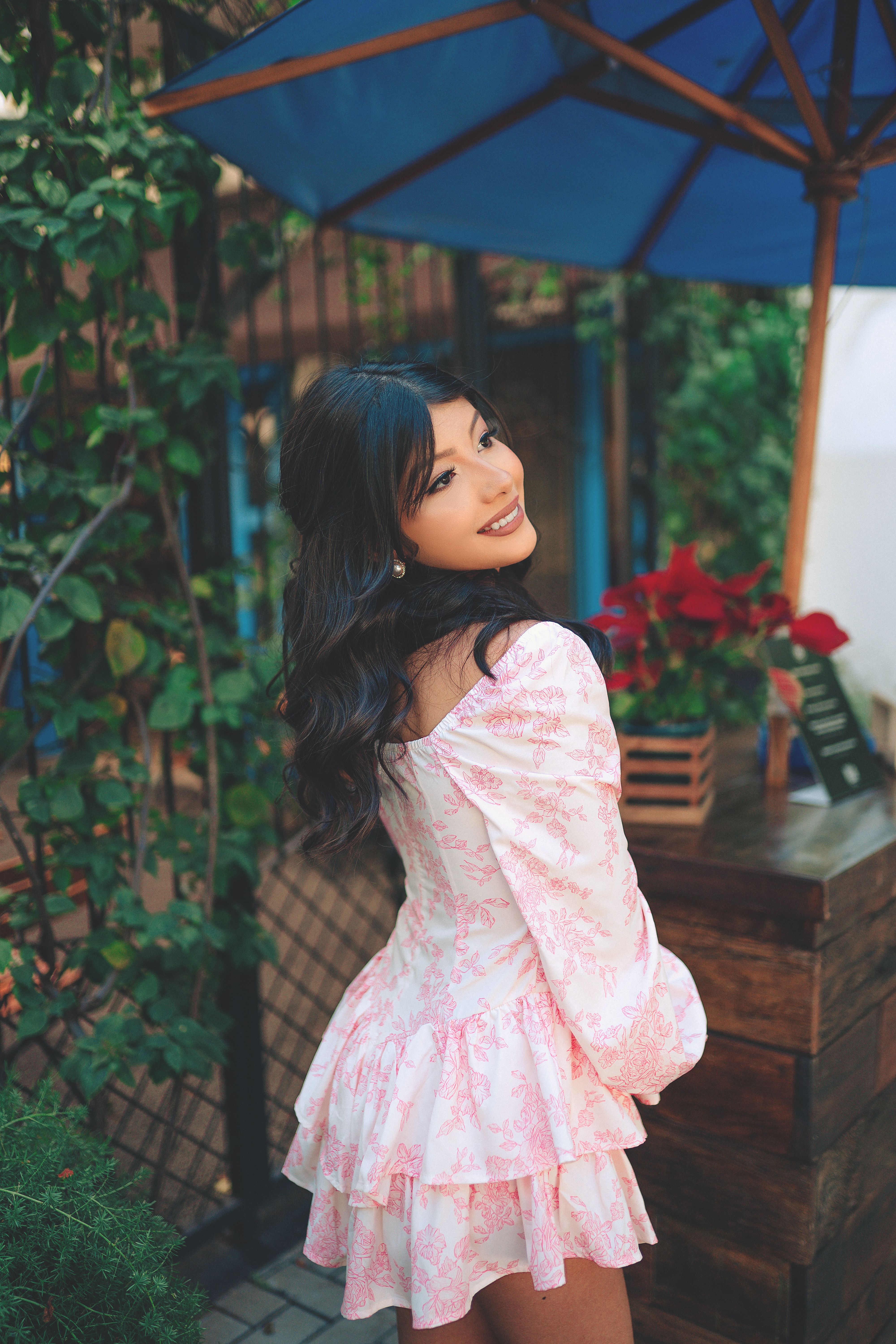 Photo of a Smiling Woman in a Pink Dress · Free Stock Photo