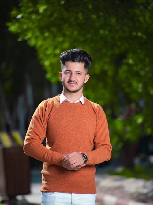 Portrait of a Young Elegant Man in a Park 