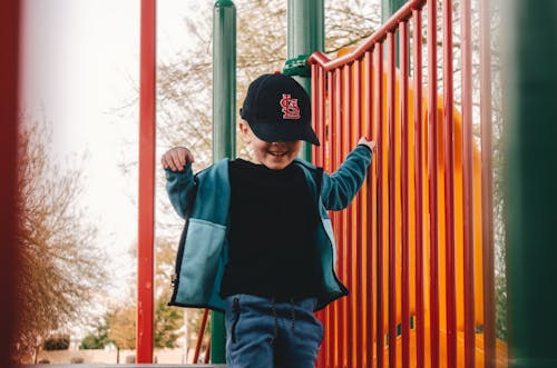 Smiling Boy Playing on Playground