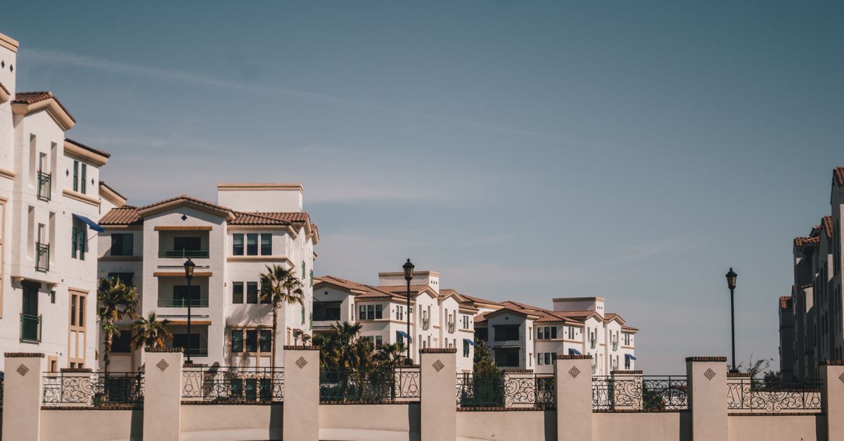 Charming residential district in Chandler, AZ featuring a bridge and canal on a sunny day.