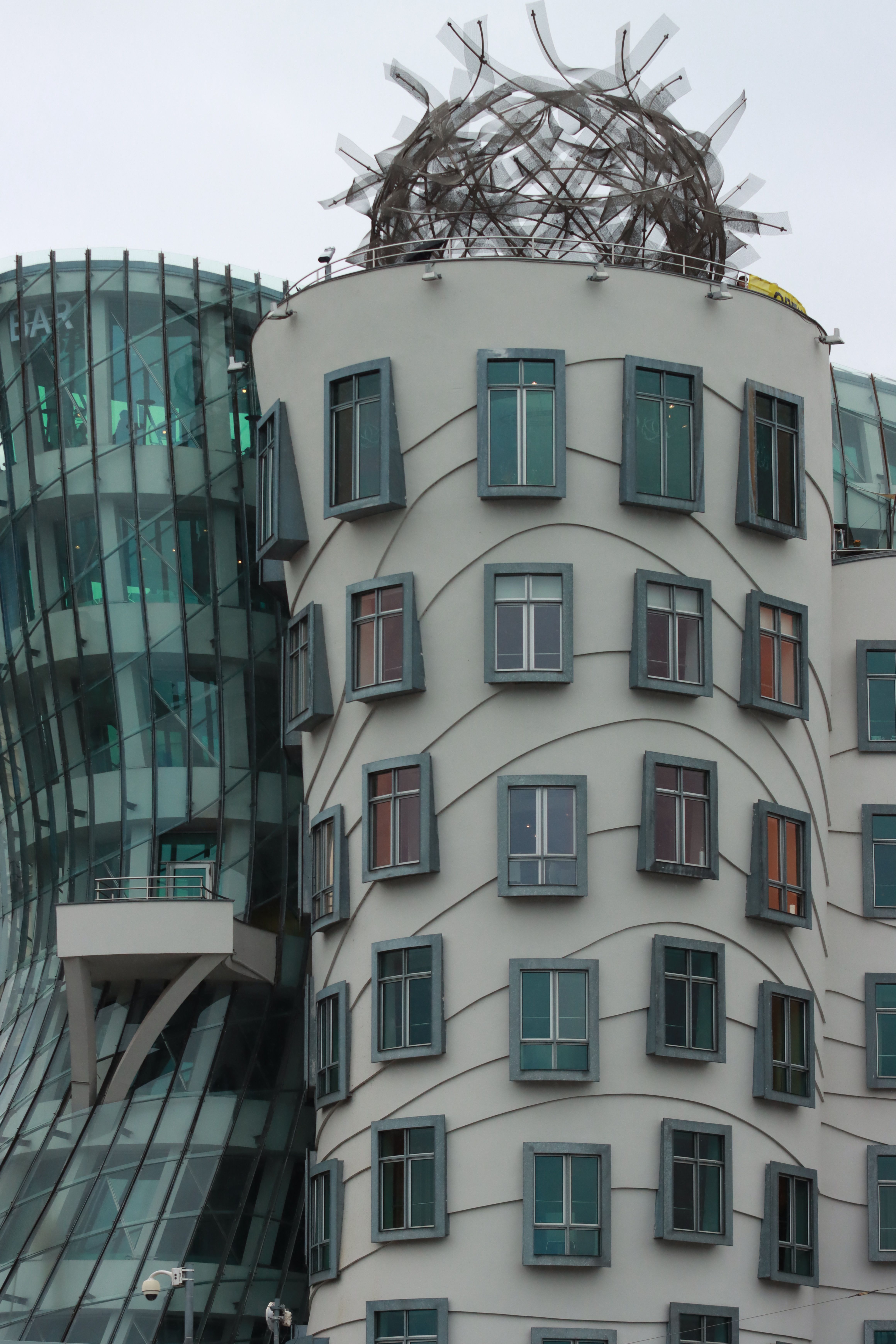 Explore the modern and futuristic design of the Dancing House in Prague, Czech Republic.