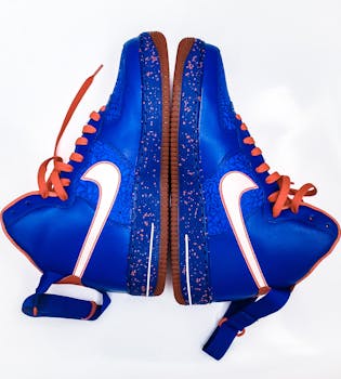 Vibrant blue and orange high-top sneakers with unique design details.