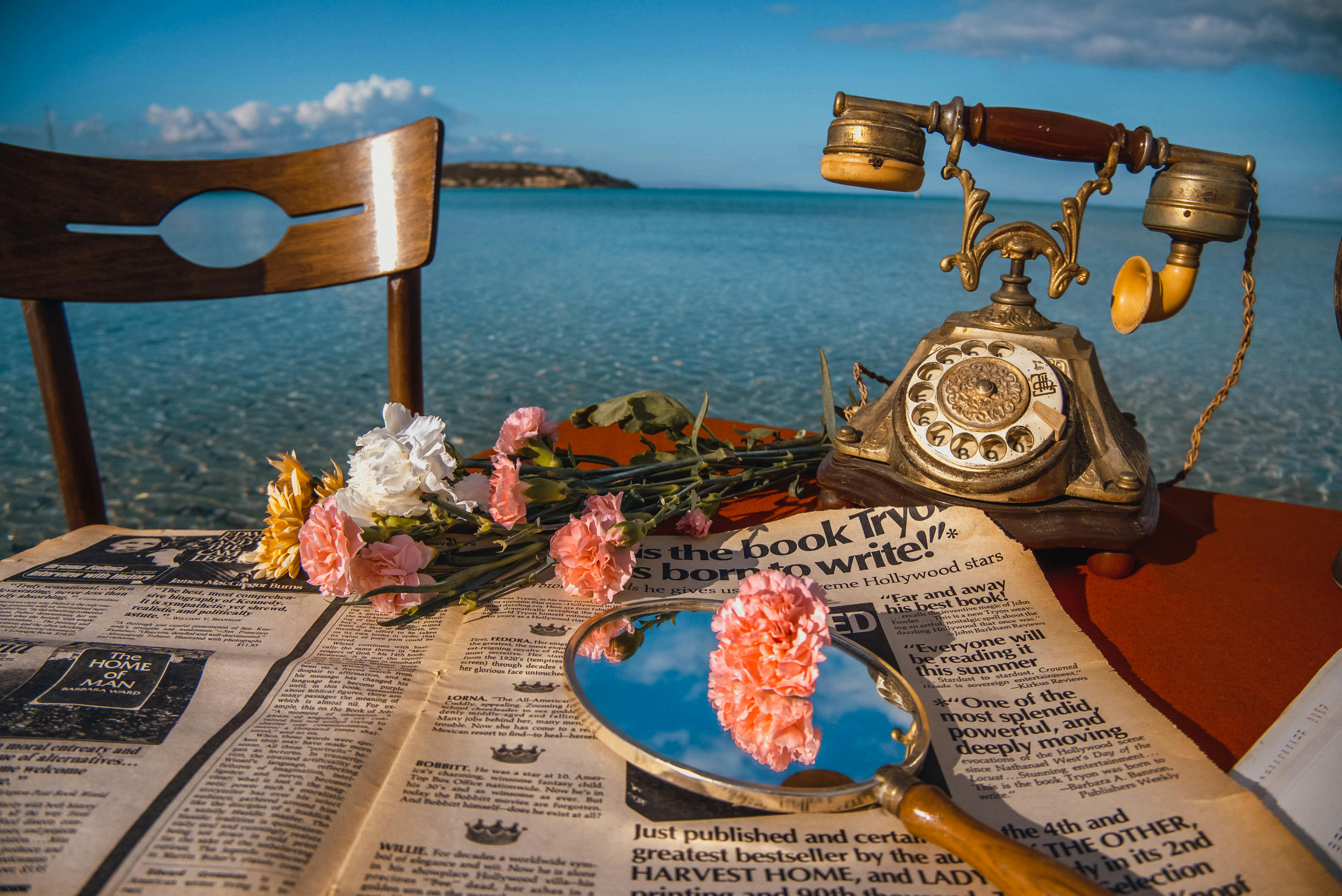 Retro Phone and Flowers on Table in Sea · Free Stock Photo, image size:1123x750