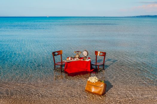 An enchanting vintage dining setup on a serene seashore with a nostalgic retro vibe.