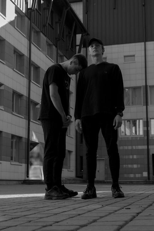 Men in Streetwear Posing on City Street