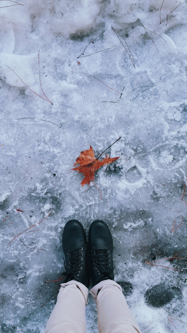 Person Standing On Snow