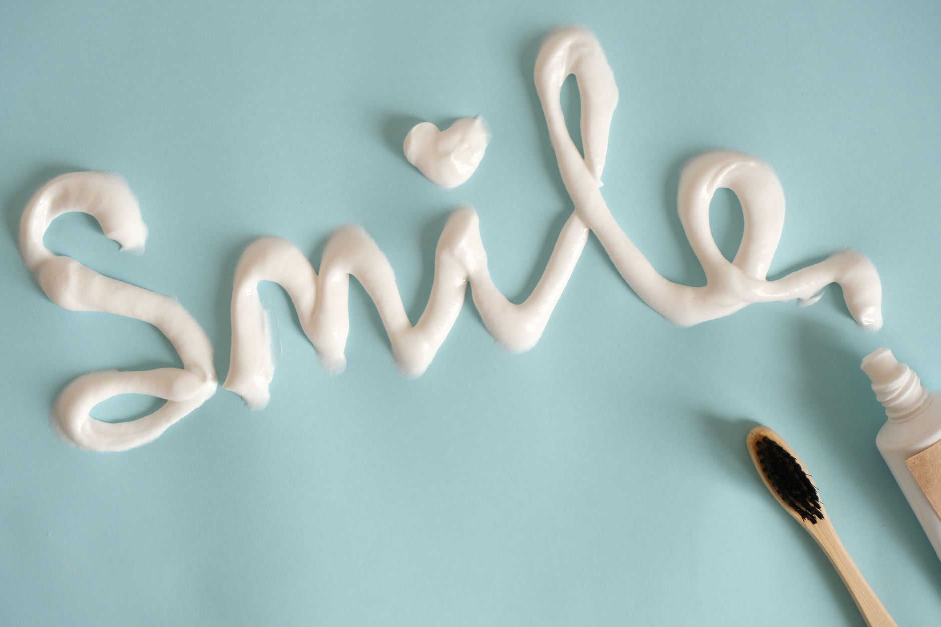 Word Smile Drawn with Toothpaste