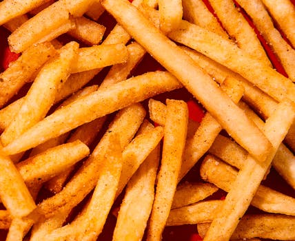 A tempting close-up shot of golden crispy french fries seasoned to perfection.