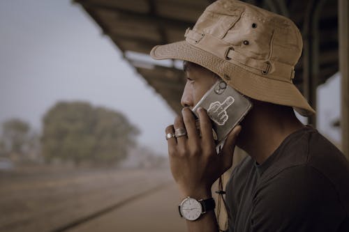 Man in Panama Talking on Phone on Platform