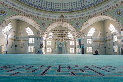 Man Praying Inside a Mosque