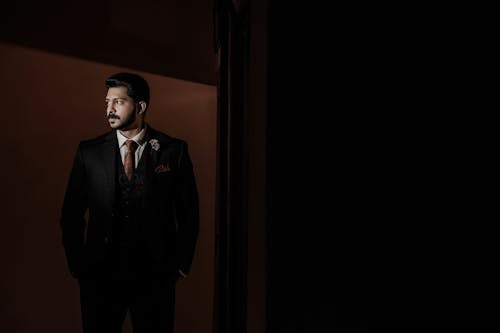 Man in Suit in Darkness