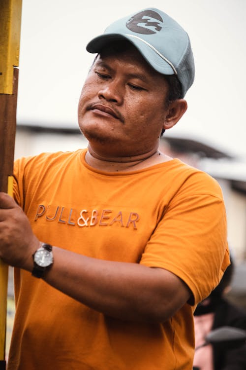 Man in Cap and T-shirt