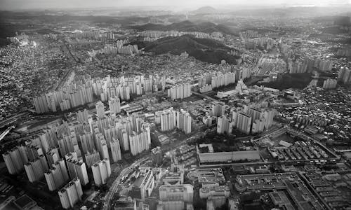 Grey High Rise Buildings Capture from High Angle in Greyscale Photo