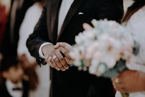 Close up of Newlyweds Holding Hands