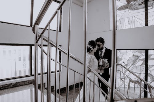 Newlyweds on Marble Staircase
