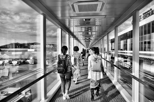 Grayscale Photo of Woman Walking on Pathway