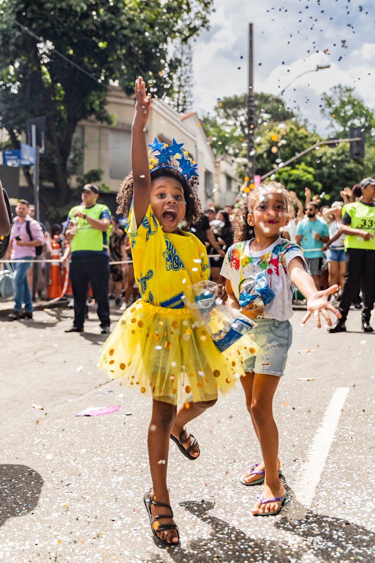 Kids Throwing Confetti During Festival