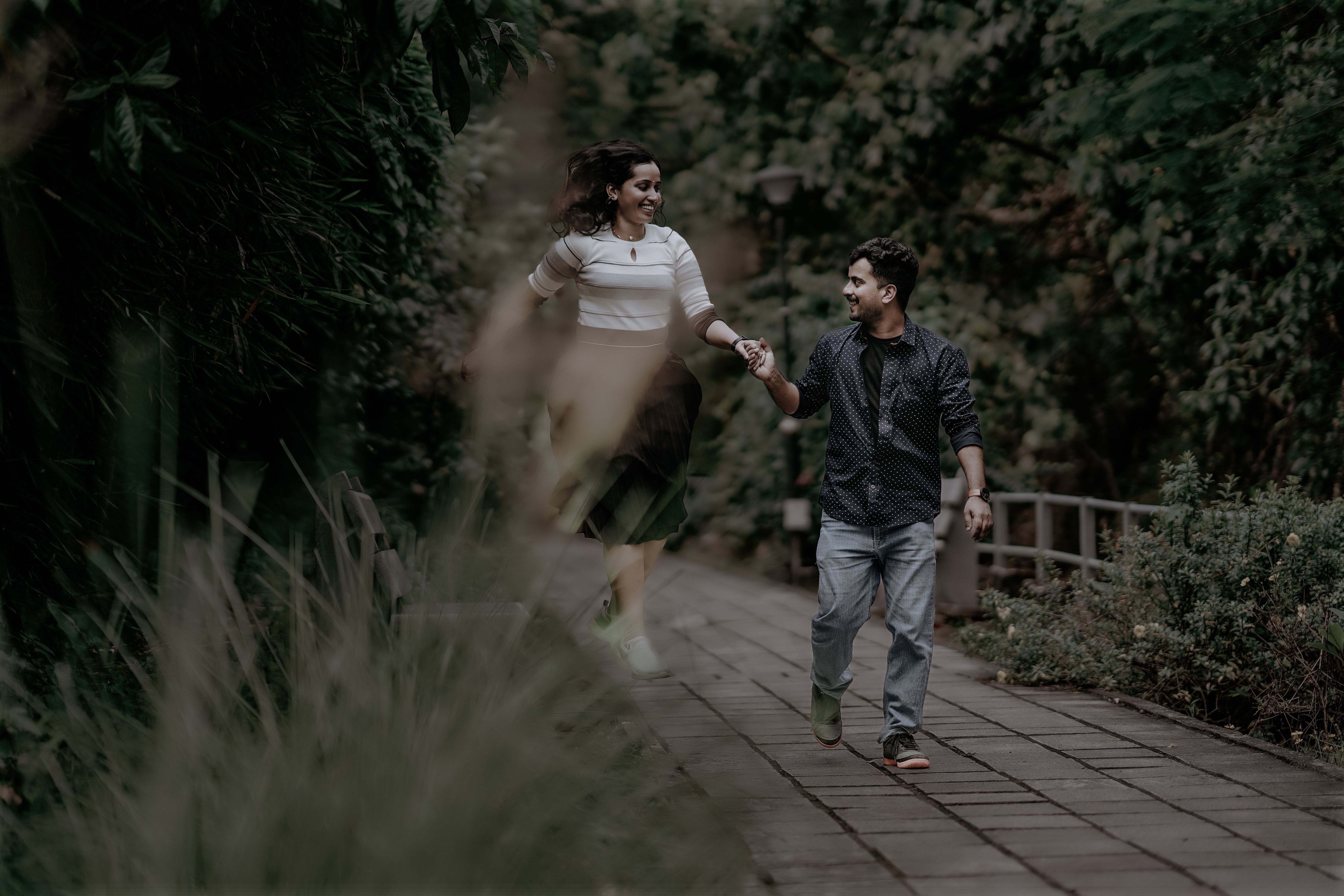 A Couple Walking at the Park while Holding Hands · Free Stock Photo