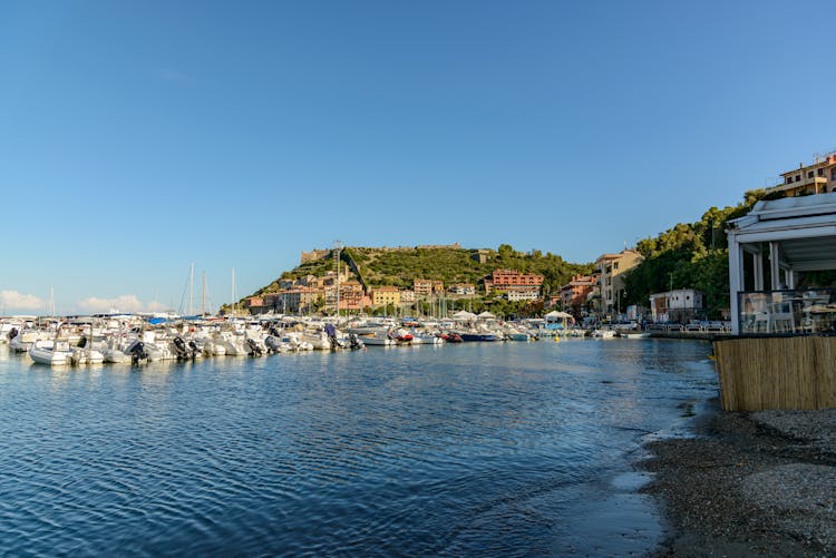 Yachts In Harbor In Coastal City