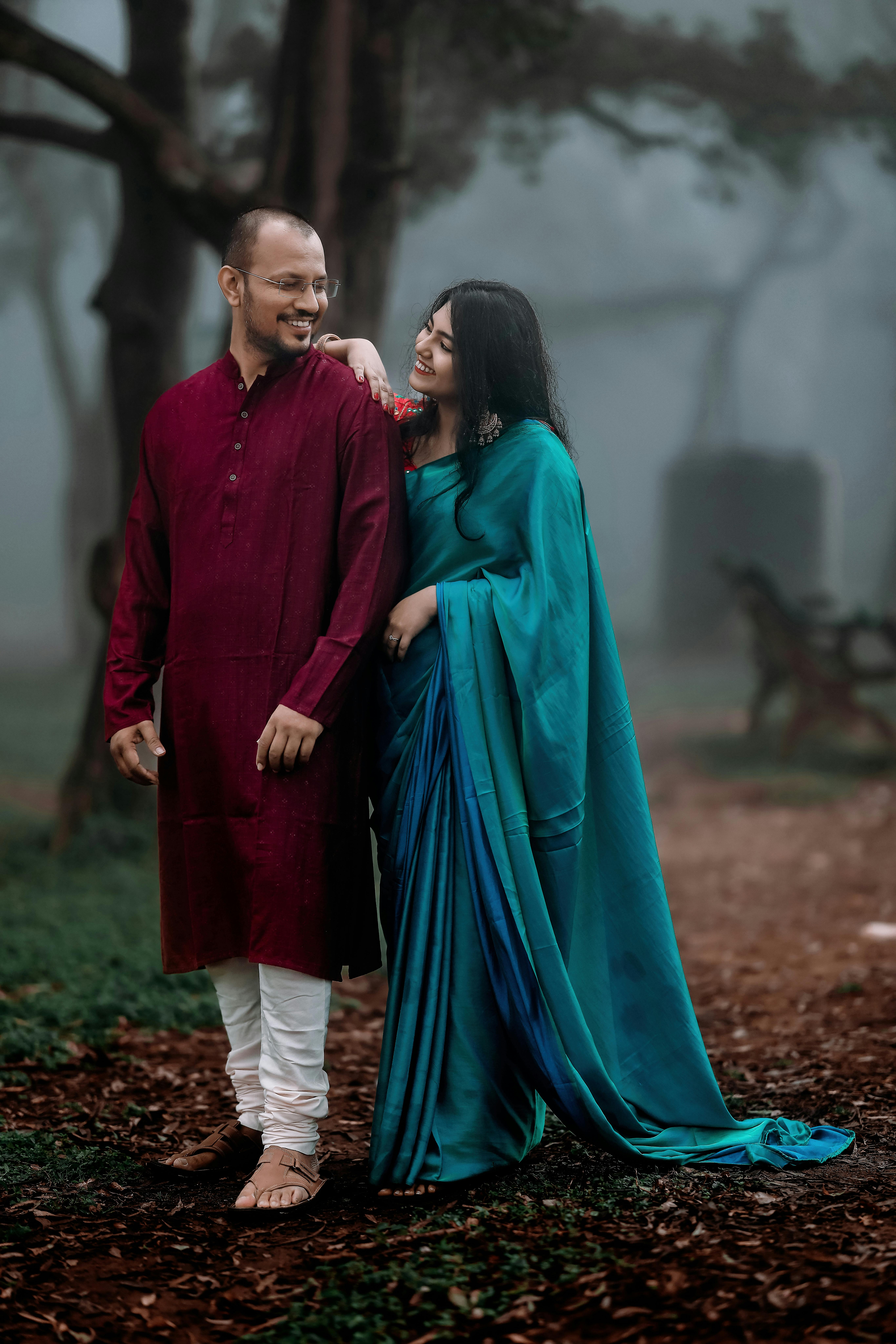Photo of Wedding day candid couple shot in traditional outfits