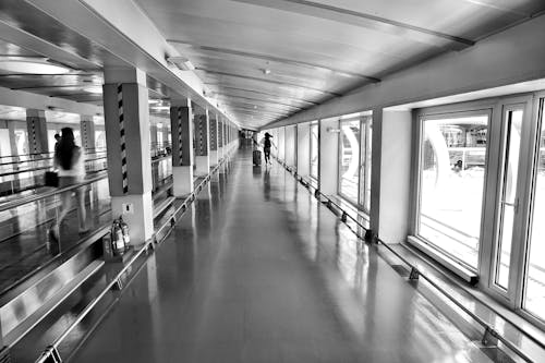 Woman Running on Hallway