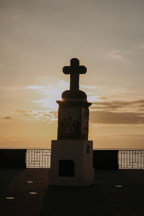 Monument with Cross at Sunset