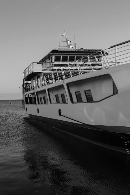 Free Elegant black and white photo of a moored passenger ship in Paphos, Cyprus, evoking travel memories. Stock Photo