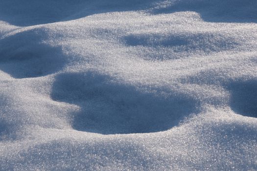 Close-up of a frosty snow-covered surface reflecting winter sunlight in Bursa, Türkiye.