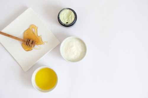 Free Flat lay image of honey, cream, oil, and natural ingredients for skincare. Stock Photo