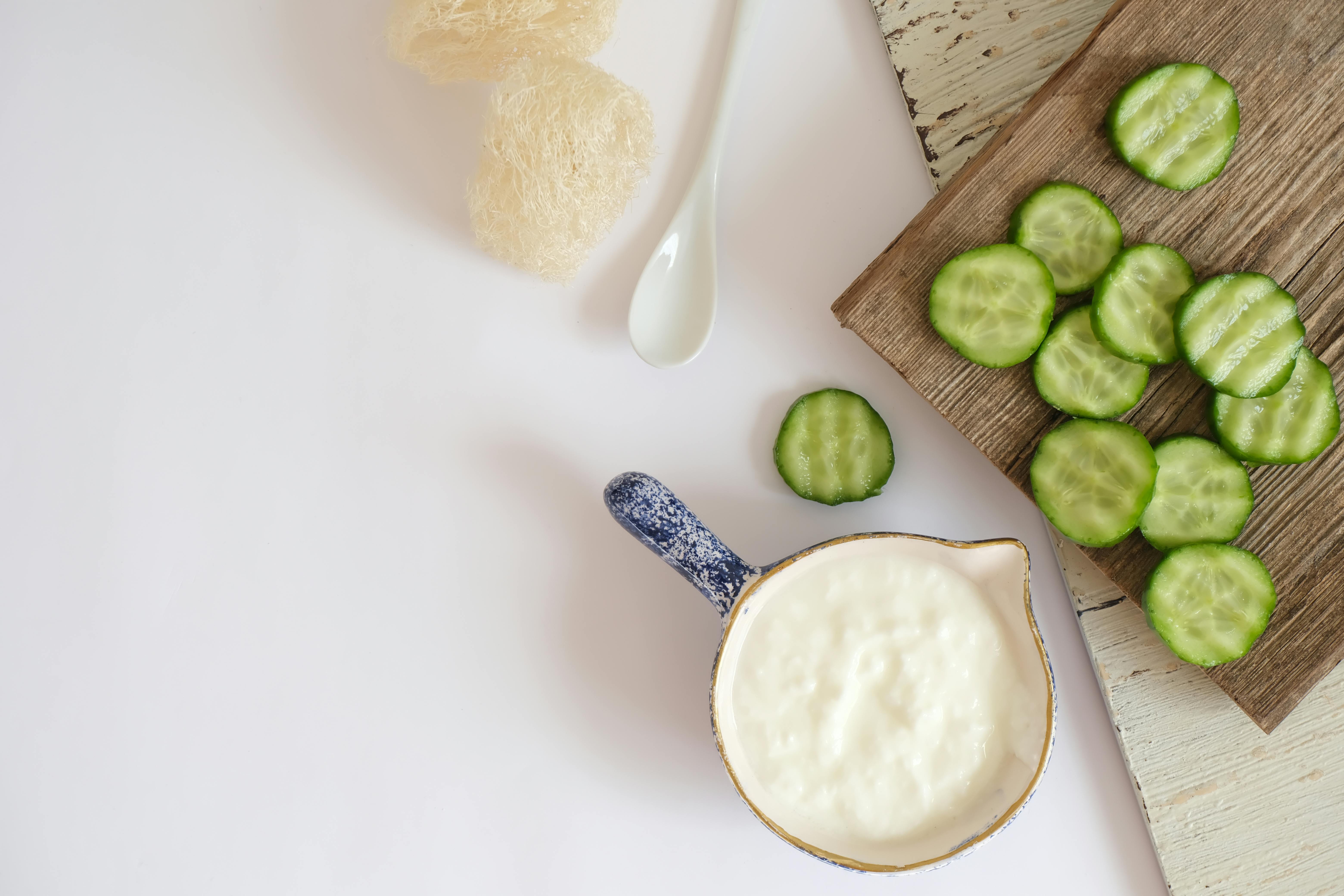 cucumber slices topped with tzatziki and fresh dill - healthy savoury snacks to make