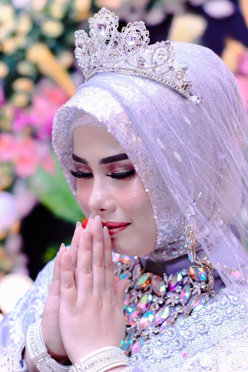 Close-up of Bride in Traditional Clothes Praying 